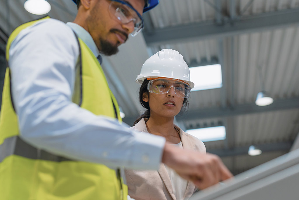 Young woman on construction site after vocational training